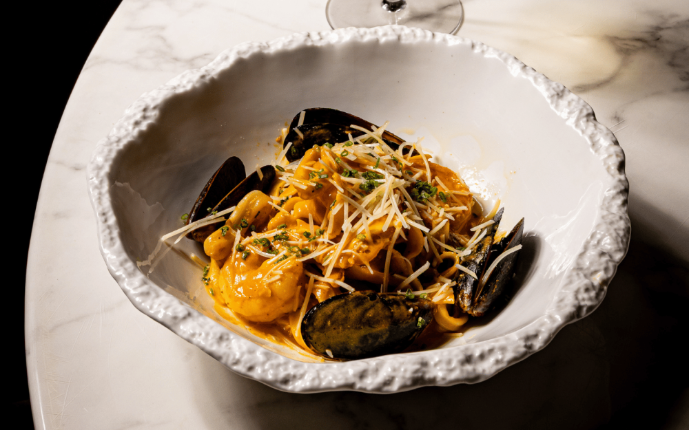 Seafood Nicabanos Pasta — Shrimp, mussels, calamari, lobster cream sauce, fresh herbs