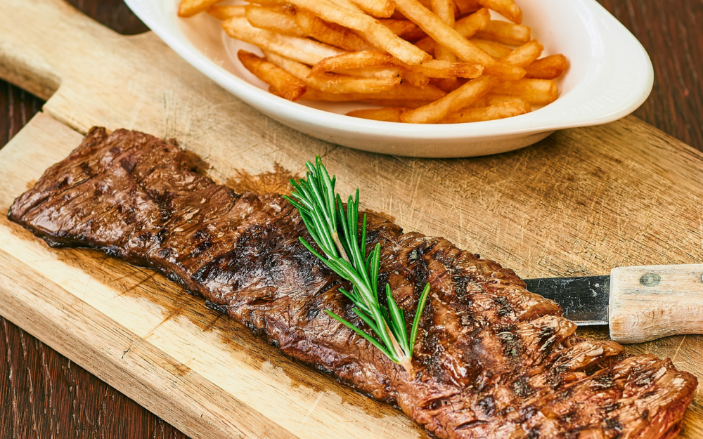 Juicy grilled skirt steak, perfectly seasoned and served with crispy golden French fries — a simple classic done right.