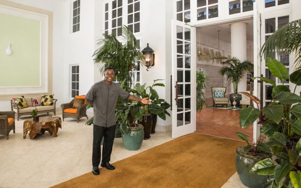 One bellman welcoming guests at front entrance
