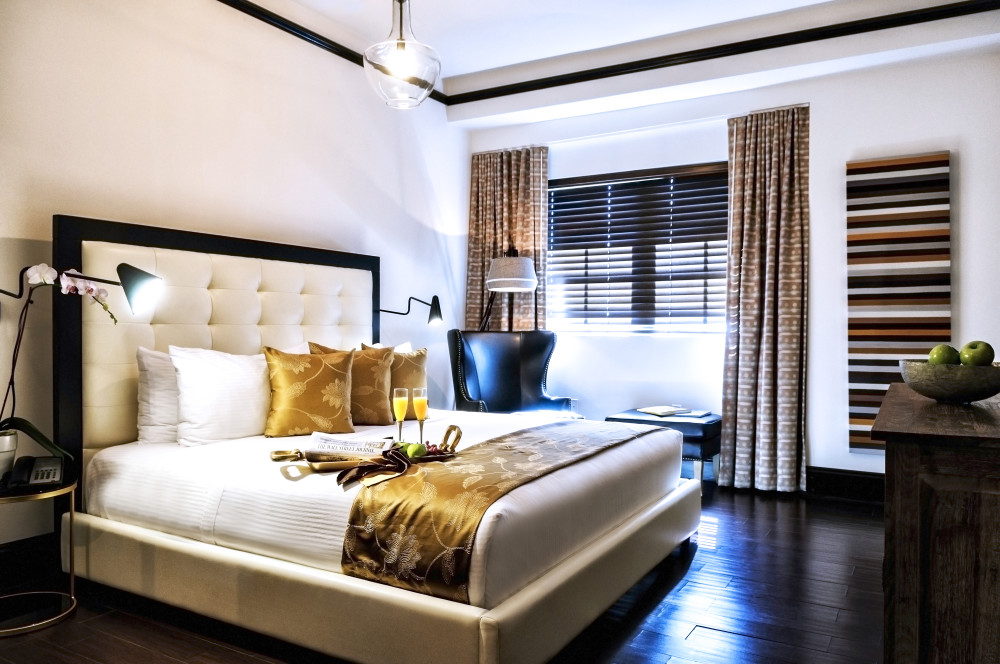 Sophisticated and elegantly embellished Queen Room is a peaceful escape from a day at the beach or shopping nearby. Our exceptionally furnished boutique room features earthy tones, luxurious cooling gel memory foam mattress, luxury C.O. Bigelow bath products, fully stocked mini bar, striking dark mahogany porcelain tile floor, iHome docking station, hair dryer, and a large flat screen TV.