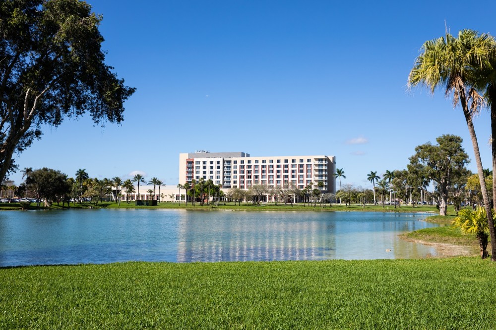 Exterior shot of building and lake