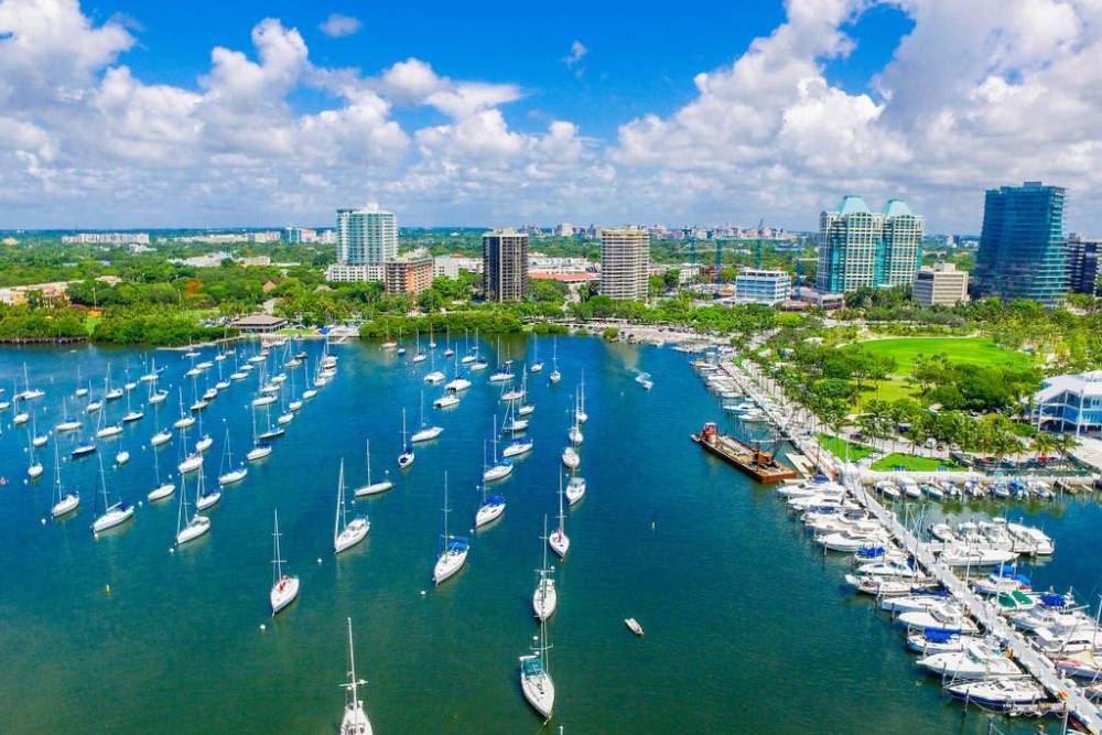 Perfectly perched in the heart of Coconut Grove overlooking the blue waters of Sailboat Bay