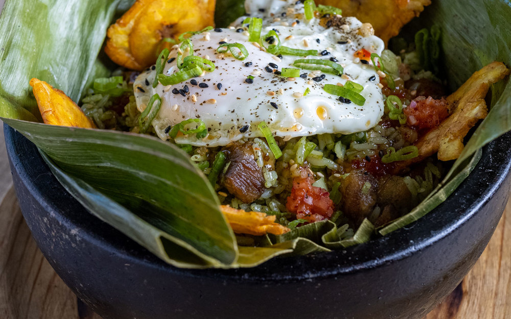 Cilantro, basil, ginger , pork belly ,plantain , toston , green onion , eggs omelette, sweet chili sauce