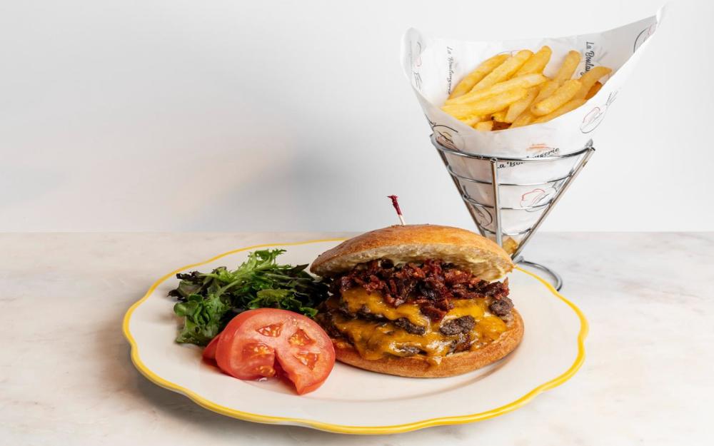 Wagyu patty burger, Cheddar Cheese, Bacon, French fries and mix salad.