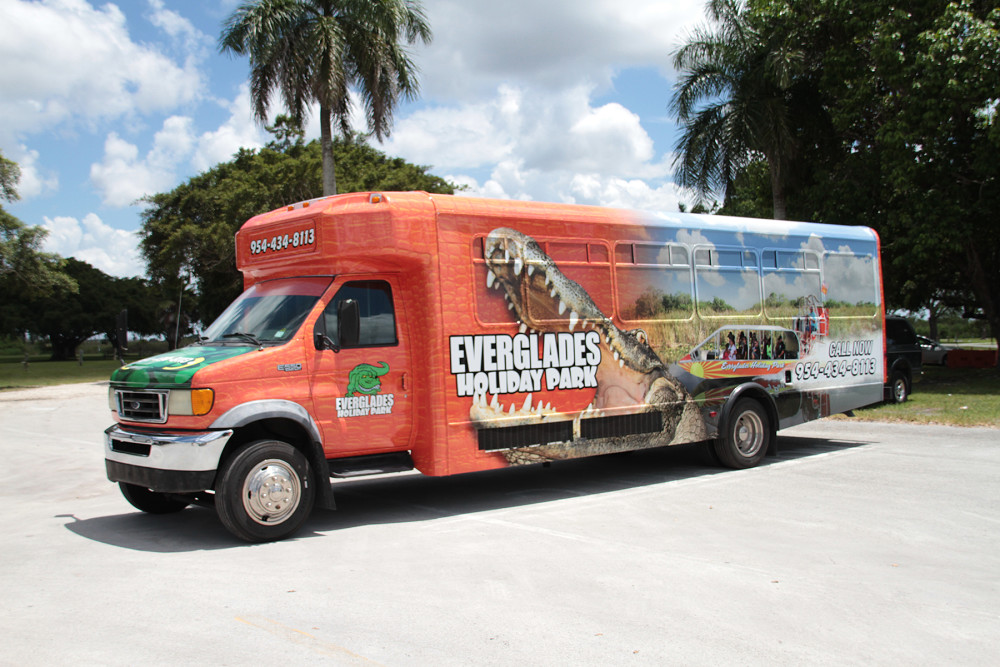 The Everglades VIP tour bus at Everglades Holiday Park offers comfortable transportation for guests seeking a seamless, upgraded adventure experience.