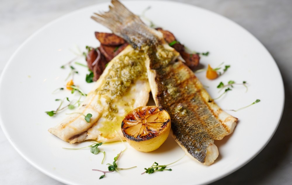 Fresh fish fillet grilled to perfection. Served with roasted potatoes tossed
with spinach, topped with a lemon-butter sauce.