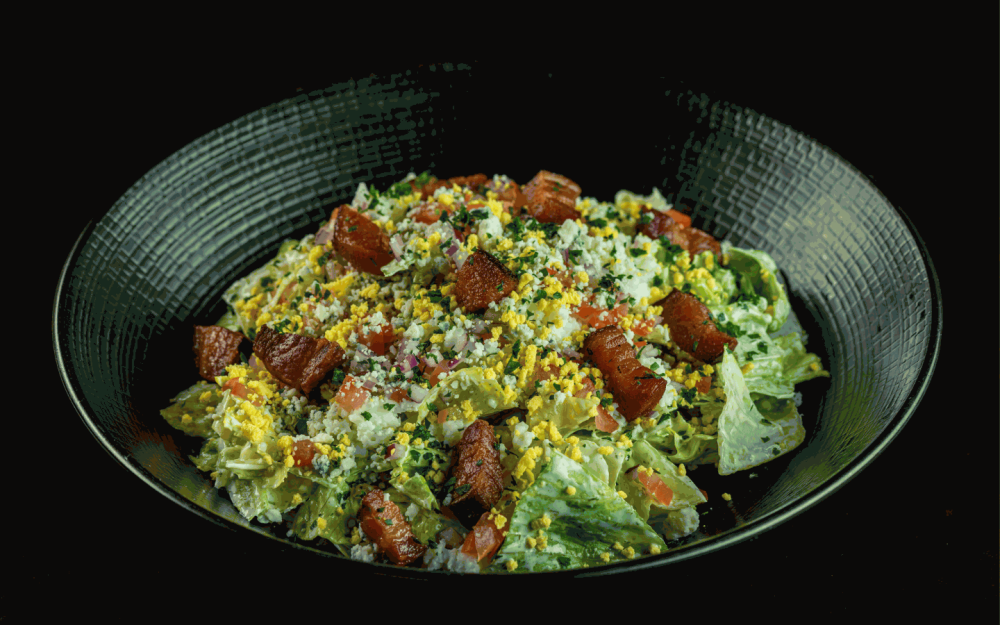 Savor the crisp freshness of our Chopped Wedge Salad.