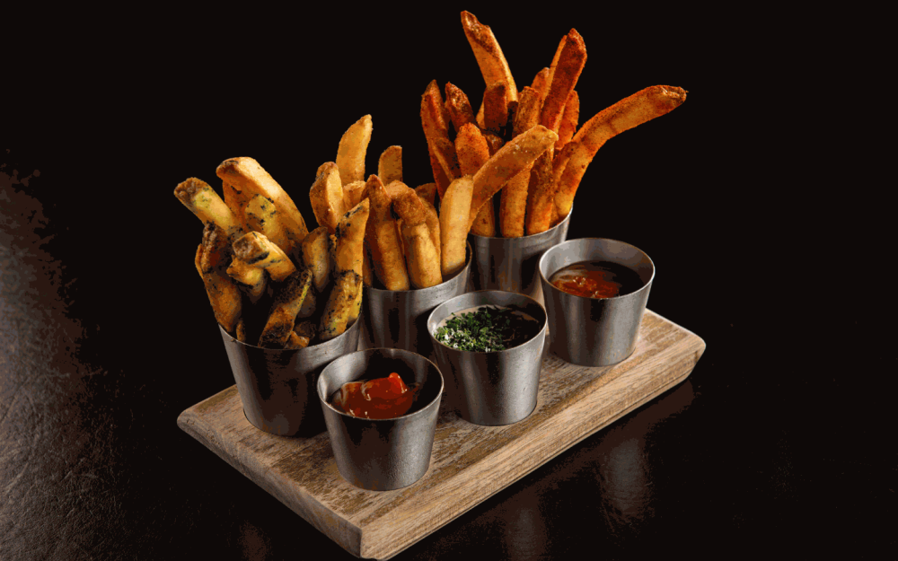 Experience fries like never before with our Bourbon Steak French Fries. Crispy on the outside, fluffy on the inside, and seasoned to perfection