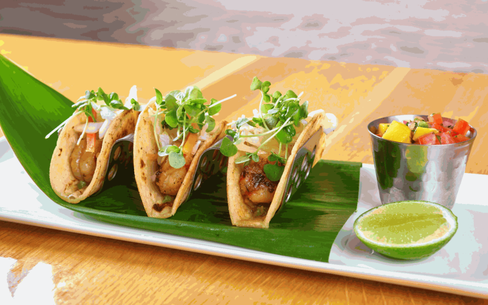 Choose between Shrimp or Fish on a corn tortilla with avocado cream, roasted tomato salsa and slaw.