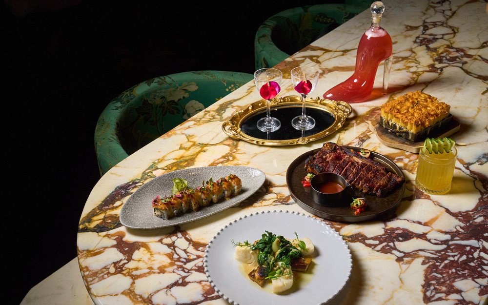 A curated selection of Giselle Miami dishes, including sushi, grilled meats and artfully plated entrées, paired with colorful signature cocktails