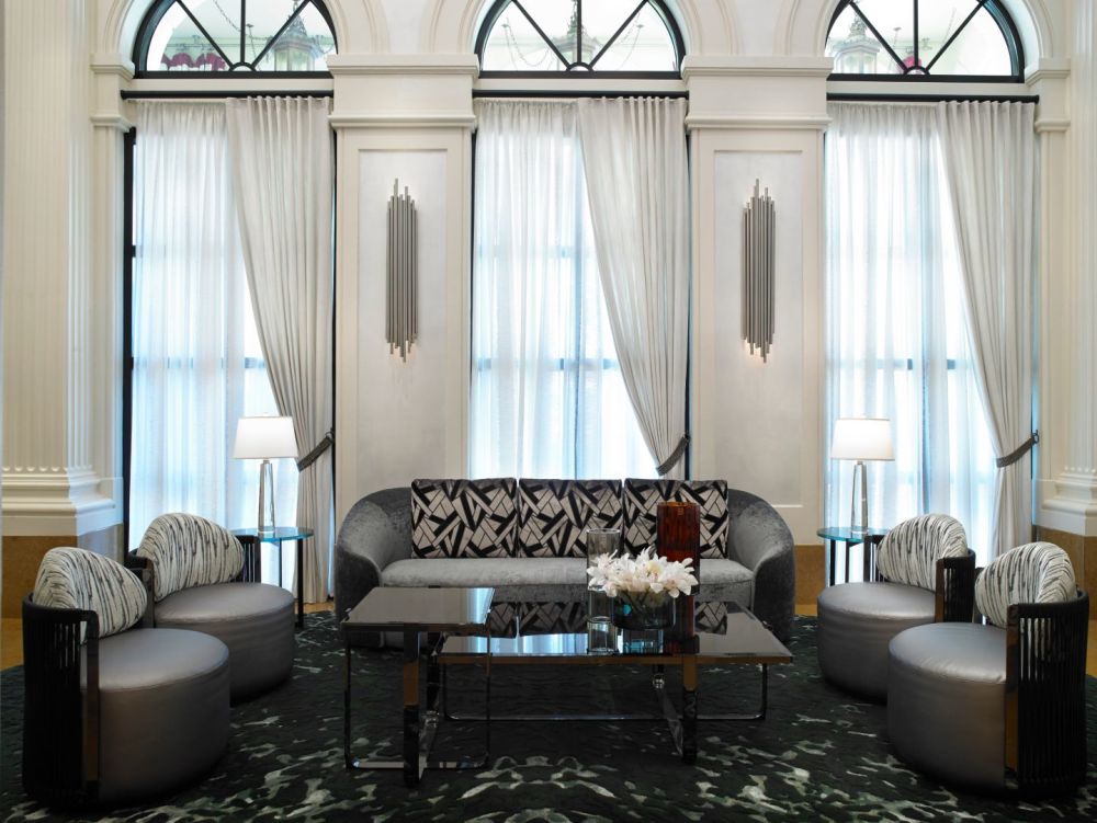 The elegant Gallery Lobby features stylish seating, soaring arched windows and sophisticated décor.