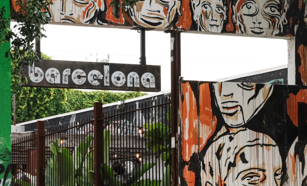 The colorful entrance to Barcelona Wine Bar reflects Wynwood’s vibrant street art scene.