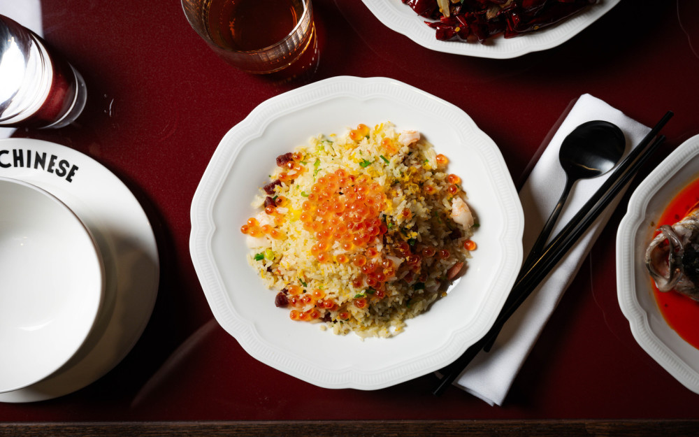 A photo of the Supreme Fried Rice topped with Salmon Roe and Grated Duck Egg.