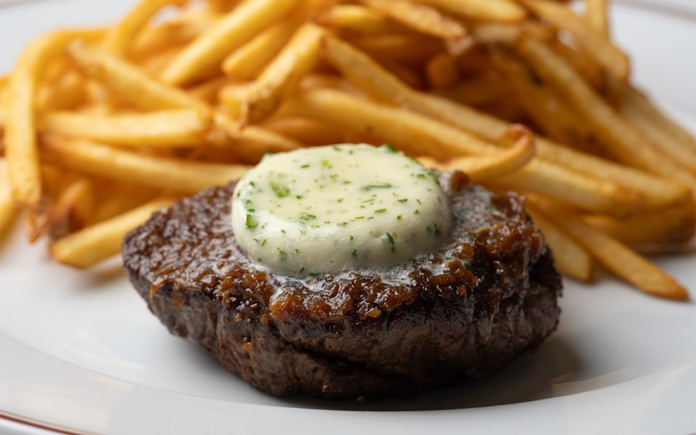 pan-seared flat iron steak, caramelized shallots & maître d’hôtel butter, served with French fries