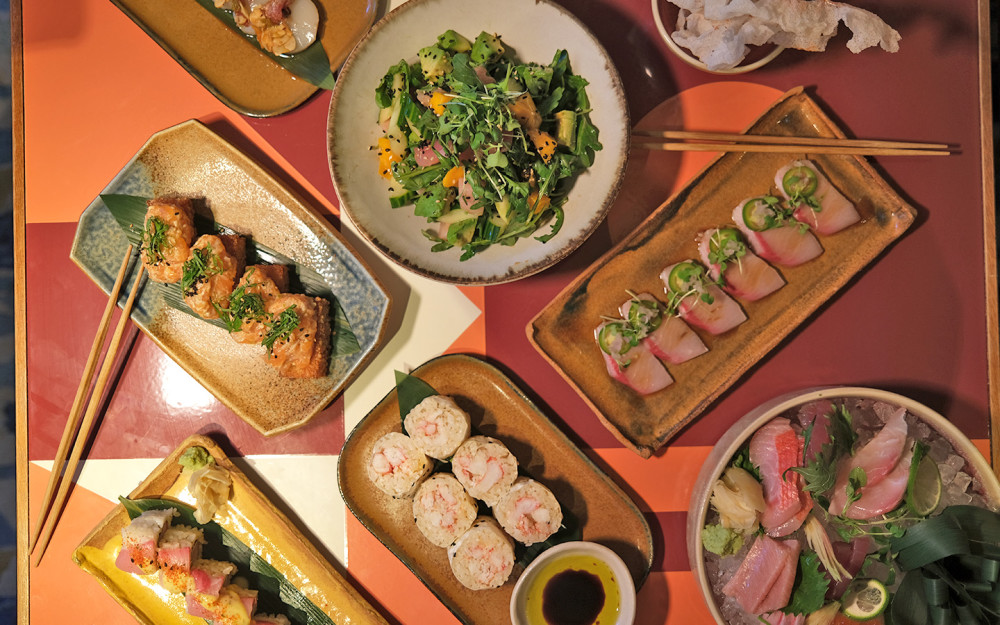 Sushi Dinner Spread with Sashimi, Crispy Rice and Butter Krab Roll