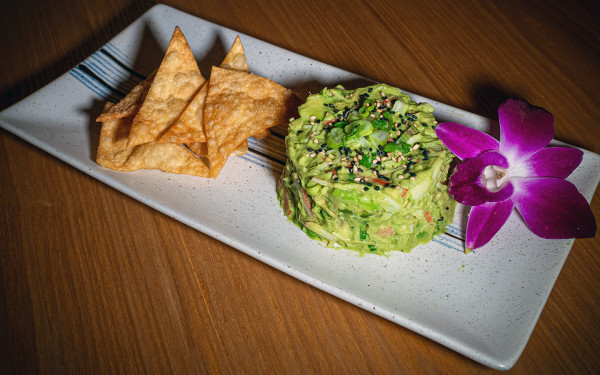 Avocado Kani Salad mad with fresh avocado, shredded crab sticks, and scallions in creamy mayo sauce
