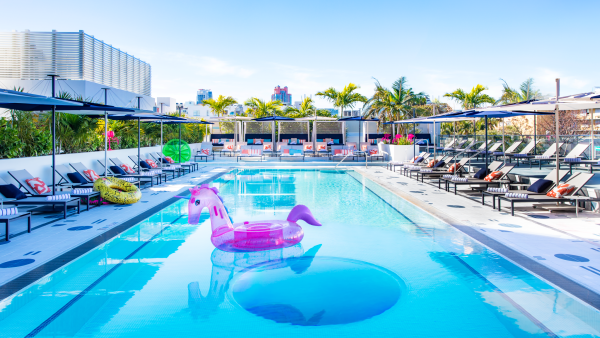 Located on the second-floor terrace, the 72-foot pool area is distinguished by its see-and-be-seen sightlines, with tiered lounge seating, luxury private cabanas, and a lush tropical perimeter of palms and ornamental plants.