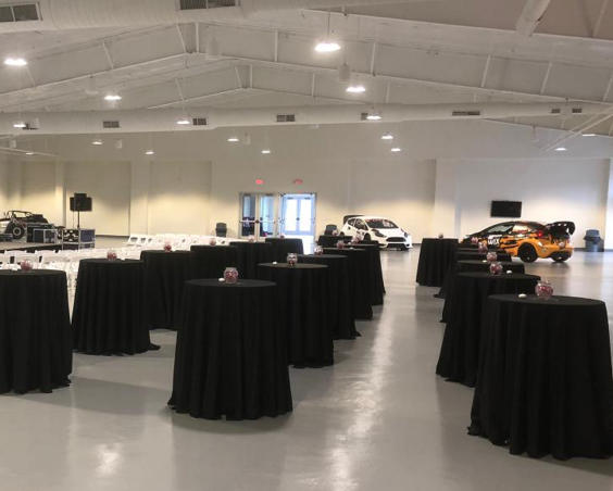 Binford Pavilion at Lucas Oil Indianapolis Raceway Park - Indoor Set Up with Dragsters