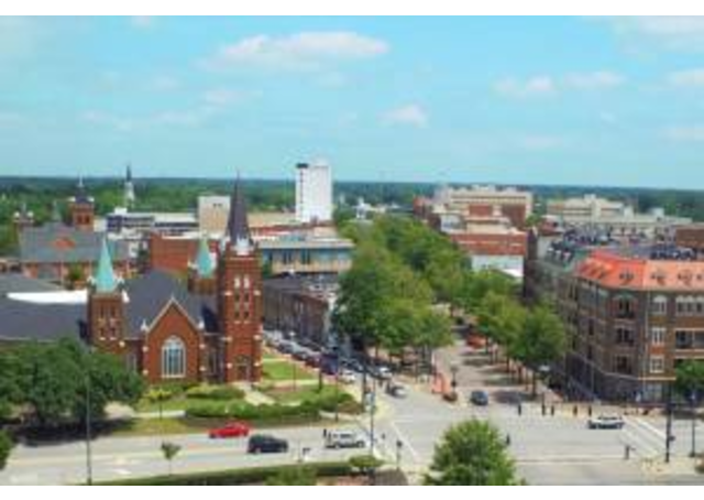 Image of downtown Fayetteville skyline on a sunny day