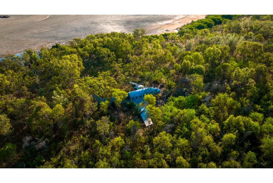 Aerial view of the DC3 WWII wreck on the Kimberley Coast, surrounded by mangroves. Kimberley expedition cruises visit this aircraft wreck on certain itineraries