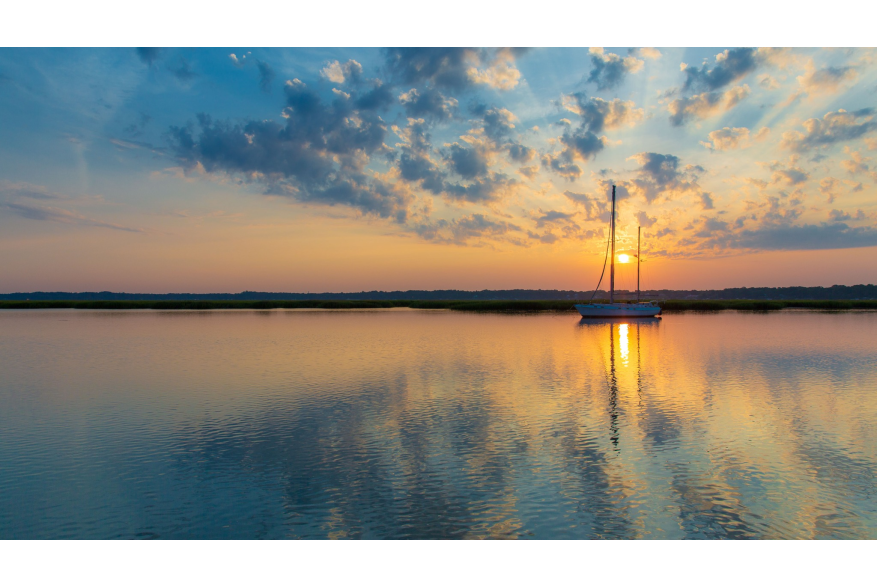 Sunset behind boat
