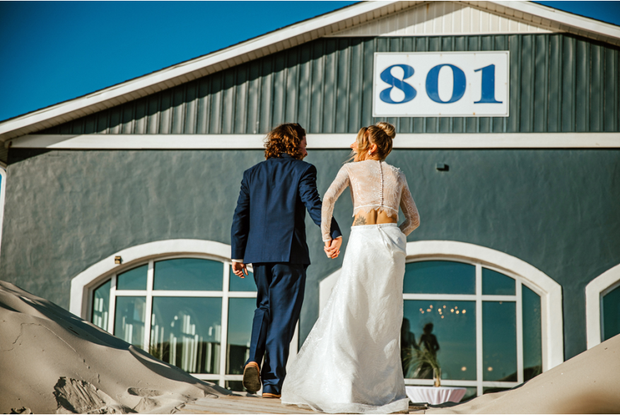 groom and bride walking hand in hand
