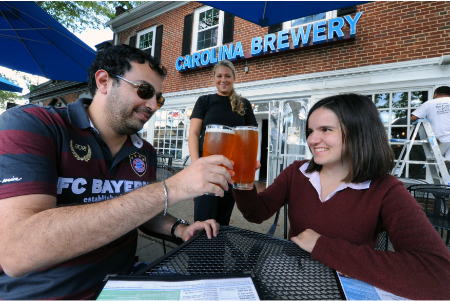 Carolina Brewery Eduardo and Liliana Carvi (patrons) Kristina Healy (server).JPG