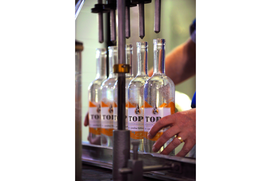 Top of the Hill Distillery filling bottles.jpg