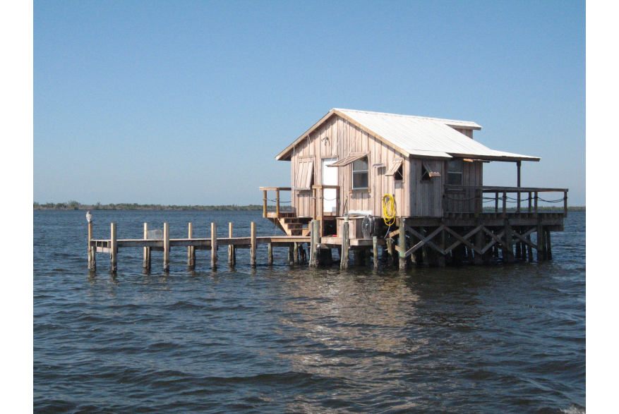 Fishing shack on pilings in Bull Bay in Charlotte County, Florida