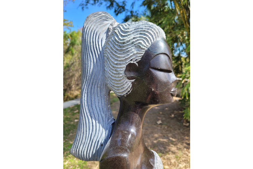 Zimsculpt: face closeup on sculpture of a woman with a ponytail