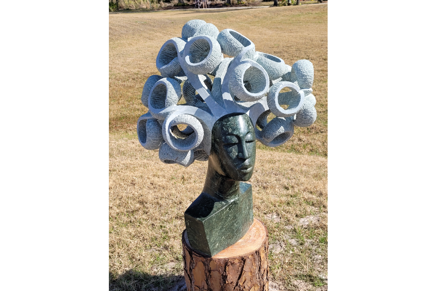 Zimsculpt: sculpture of woman with big curls