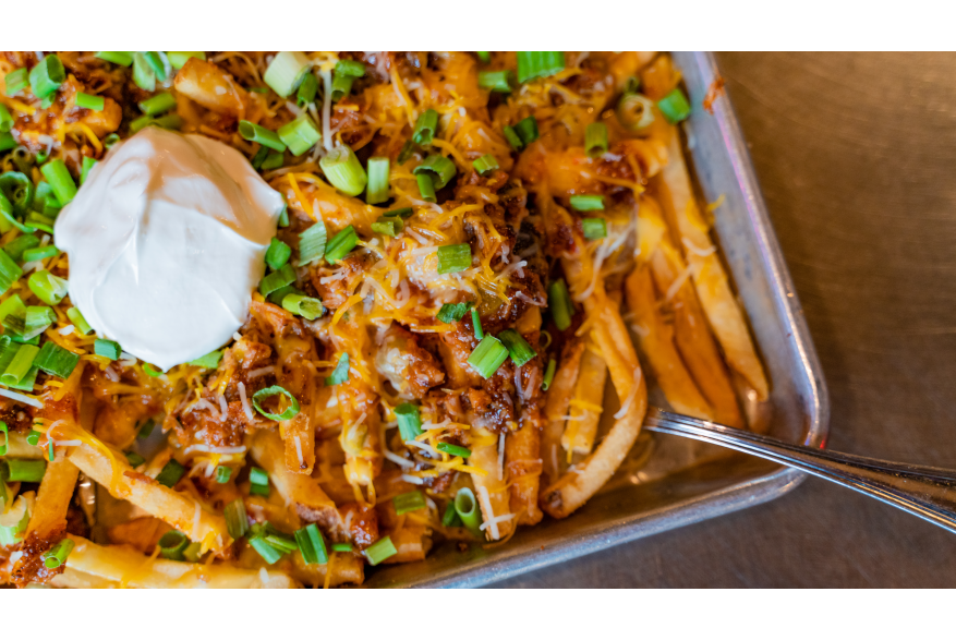 A sheet of chili cheese french fries