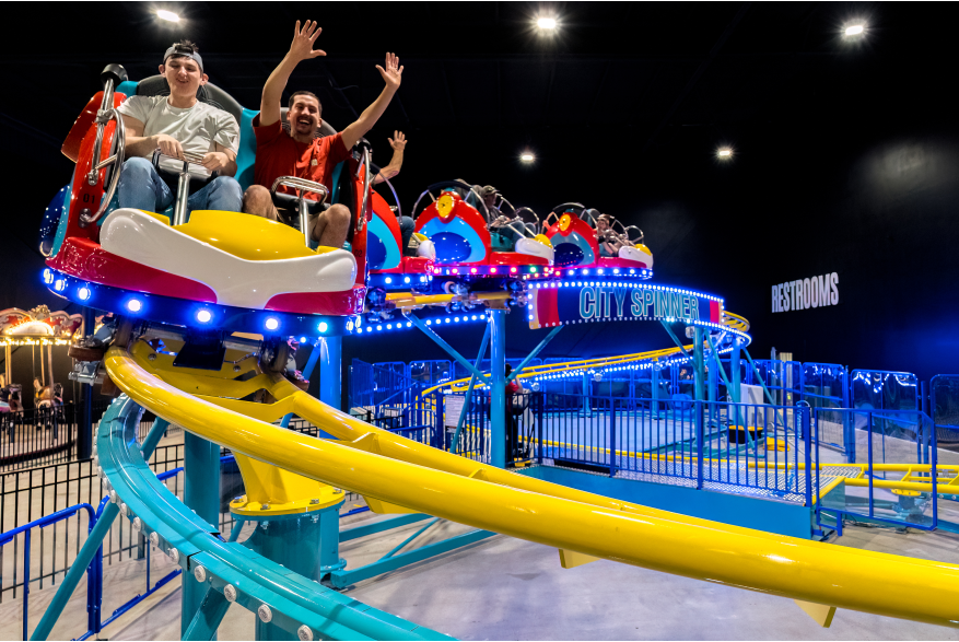 family on an indoor roller coaster