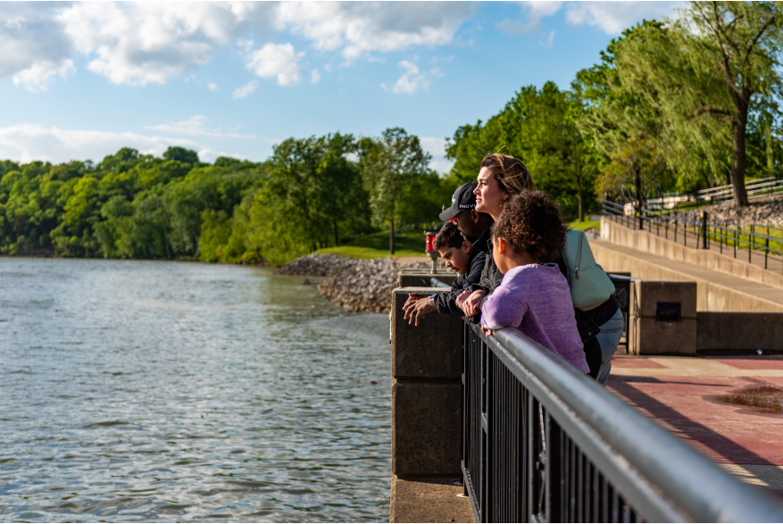 family at an overlook along the Riverwalk