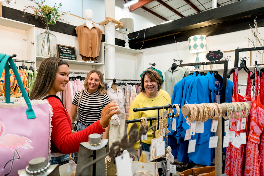 three ladies shopping in a boutique