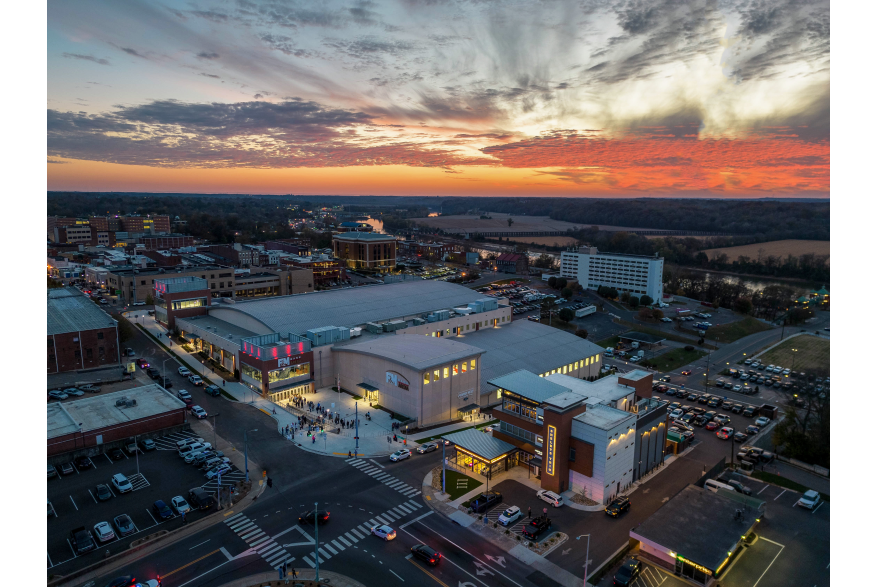 aerial shot of downtown buildings with a vivid sunset