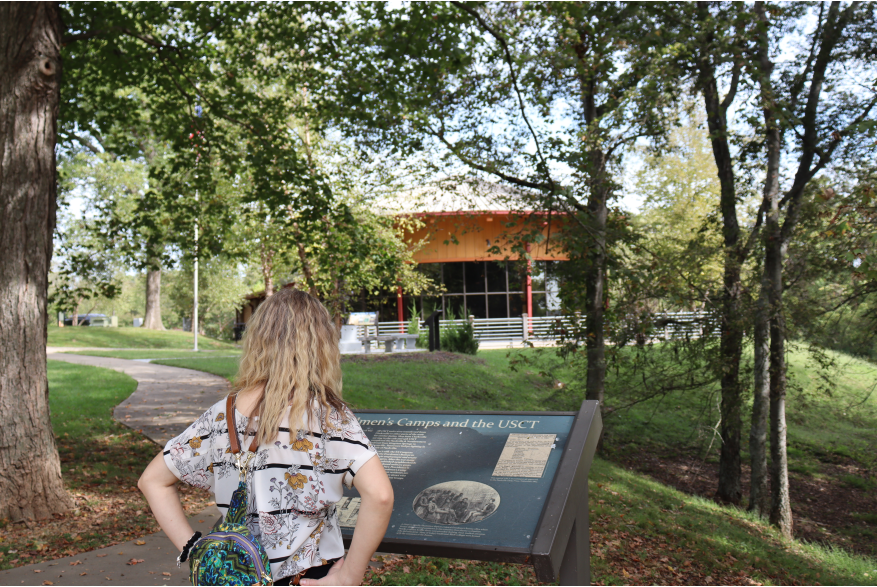 a woman reads about USCT Freedman's Camps