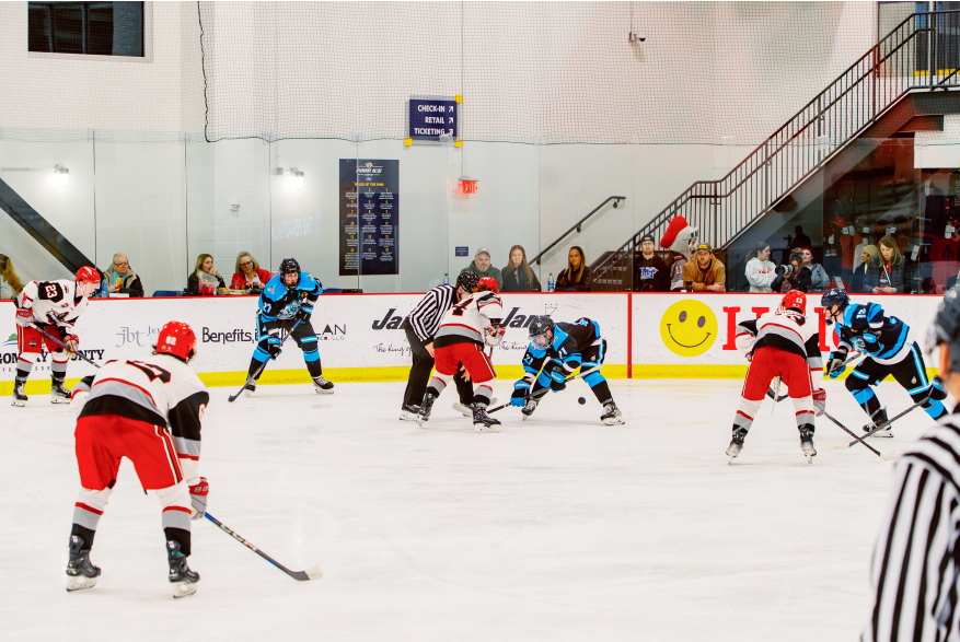 hockey game on an indoor ice rink