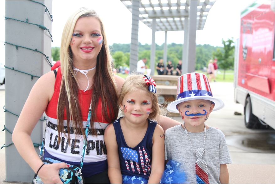 kids dressed in red, white and blue for a  4th of July celebration