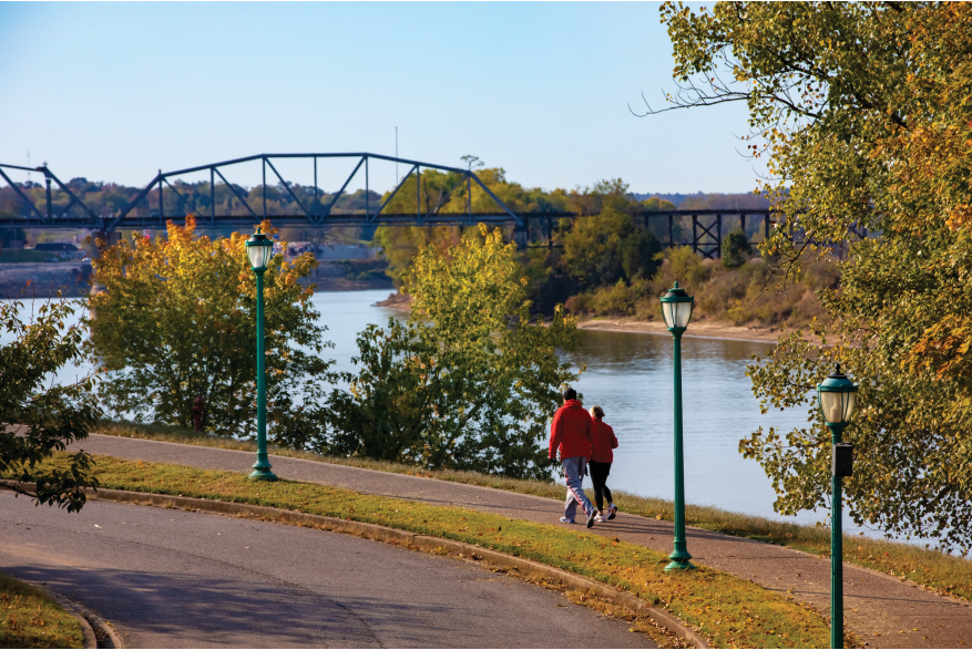 couple walking along the river