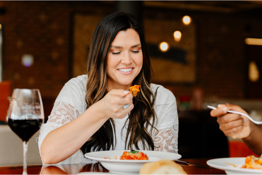 lady eating Italian food and wine