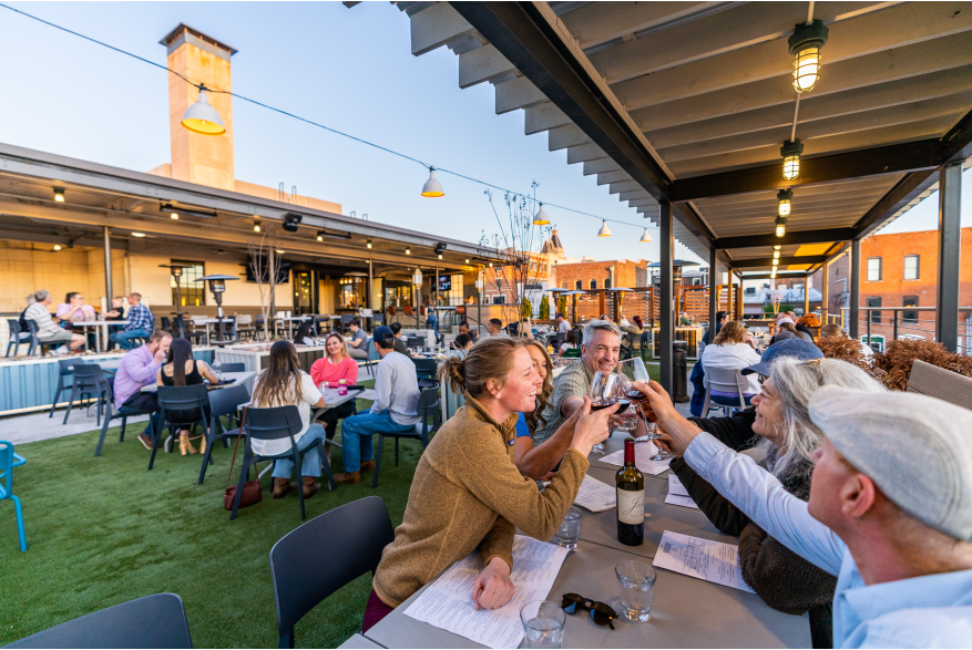 People eating outside at The Mailroom