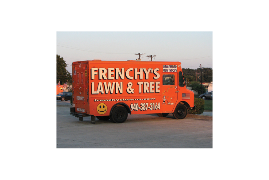 And orange truck that reads "Frenchy's Lawn & Tree"