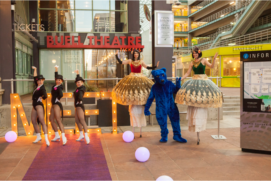 performers in front of the Buell Theatre