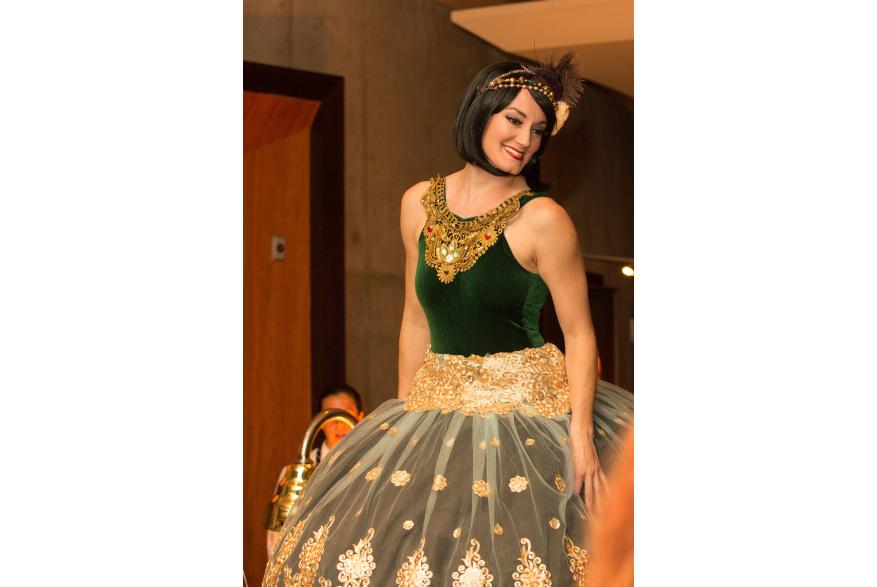 performer in gold and green costume