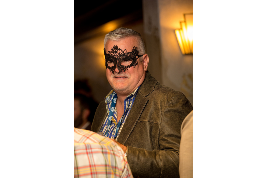 attendee in masquerade mask