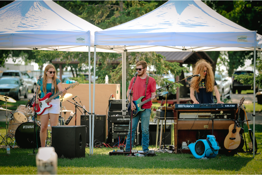 A local band. There are drums, a bass guitar, an electric guitar, and a keyboard.