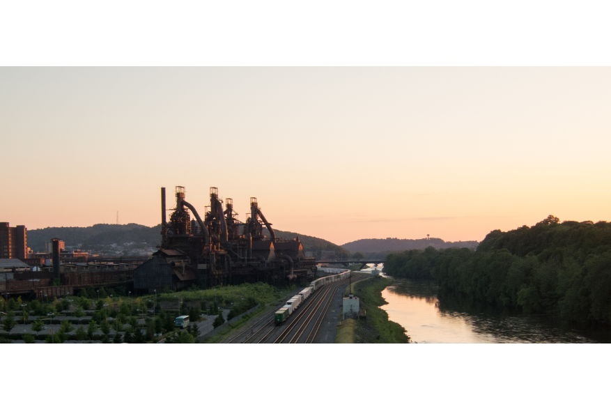 The sun sets over the Lehigh River and SteelStacks in Bethlehem, Pa