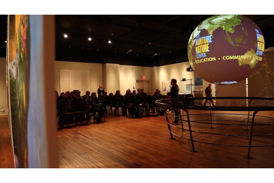 Nurture Nature Center room filled with people listening to a speaker