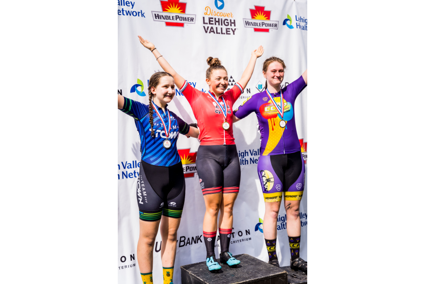 Cyclists celebrate on the podium at 2022 Easton Twilight Criterium in Easton, Pa.